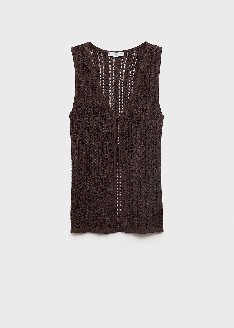 Knitted vest with bow closure