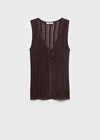 Knitted vest with bow closure
