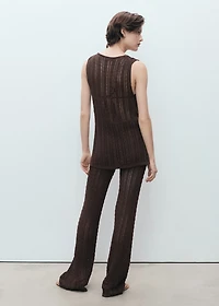 Knitted vest with bow closure