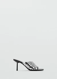 Heeled sandals with metal decorations
