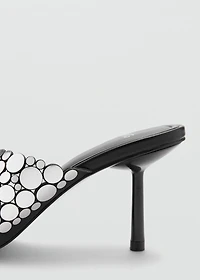 Heeled sandals with metal decorations