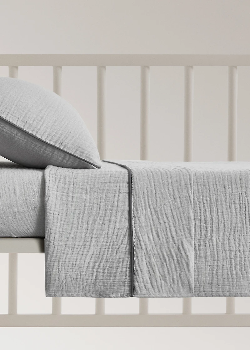 Cotton chiffon top sheet with contrast piping for cot