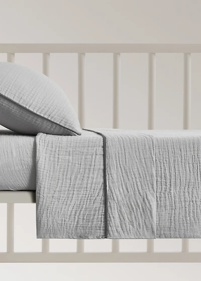 Cotton chiffon top sheet with contrast piping for cot