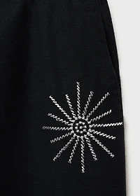 Long pants with embroidered details
