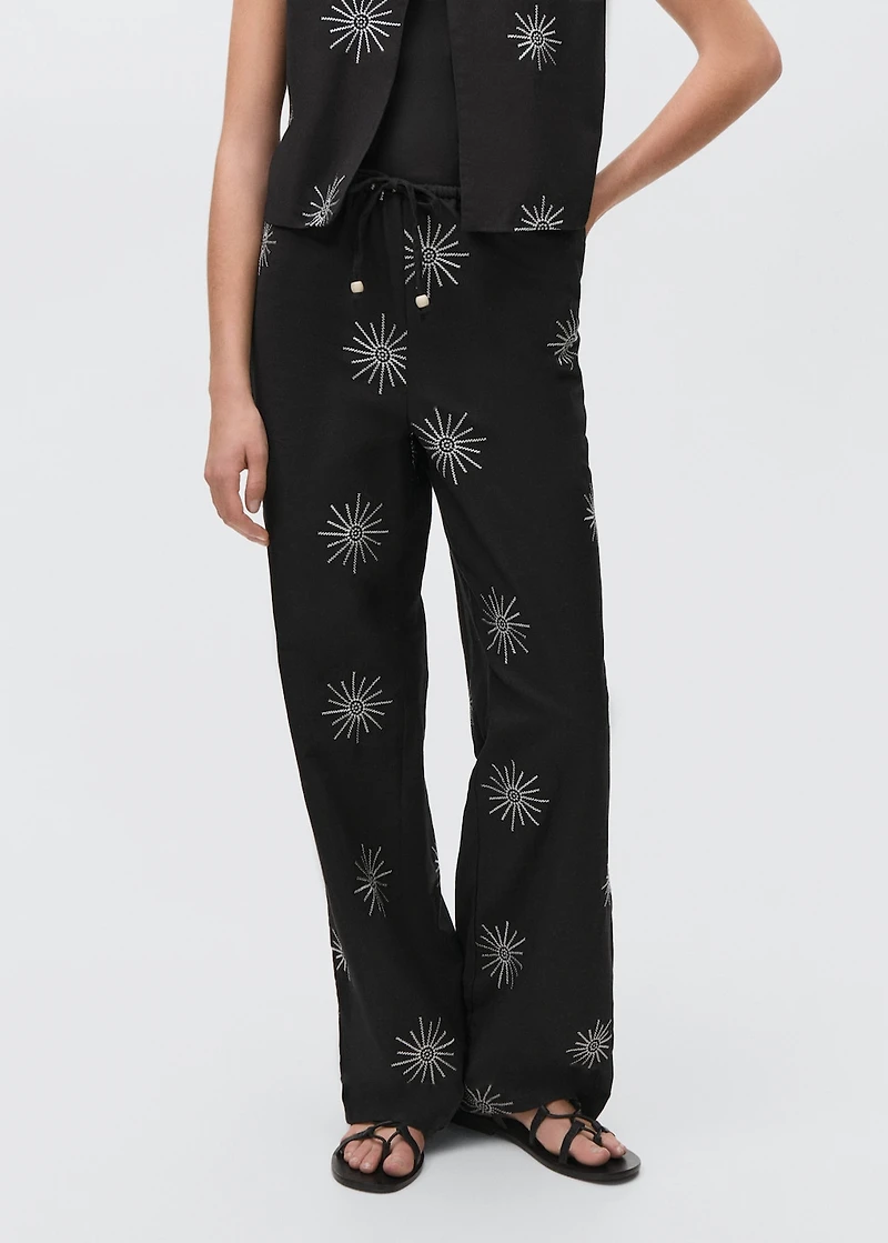 Long pants with embroidered details