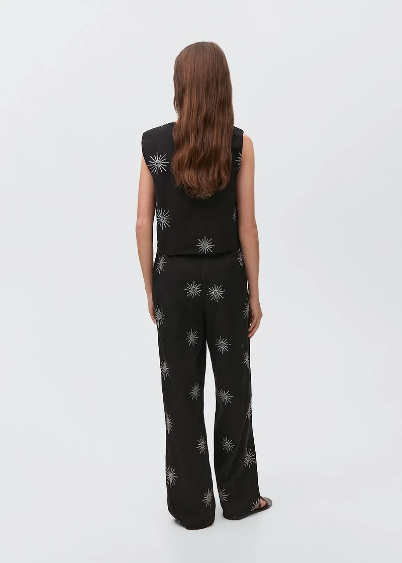 Long pants with embroidered details