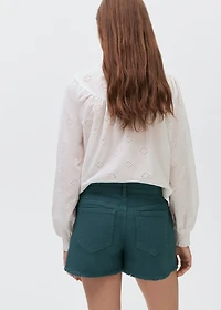 Denim shorts with frayed hem