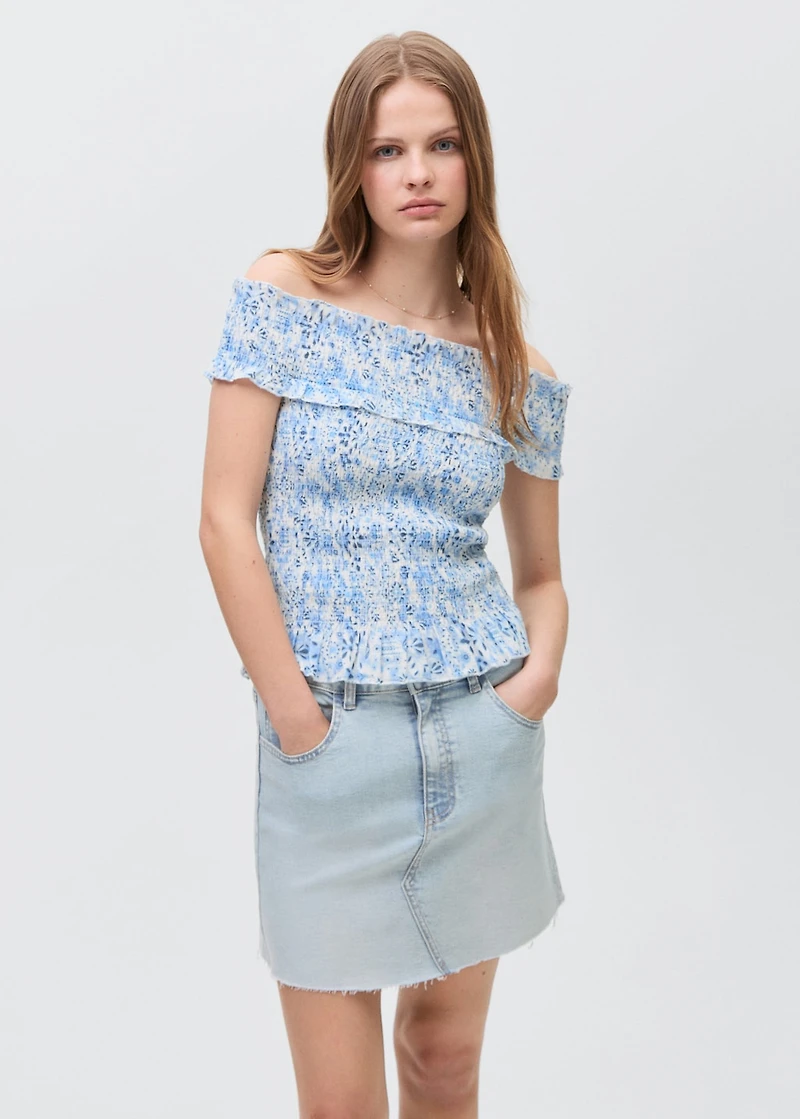Denim miniskirt with frayed hem