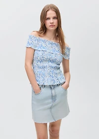 Denim miniskirt with frayed hem
