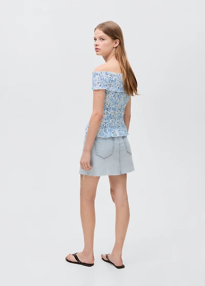 Denim miniskirt with frayed hem