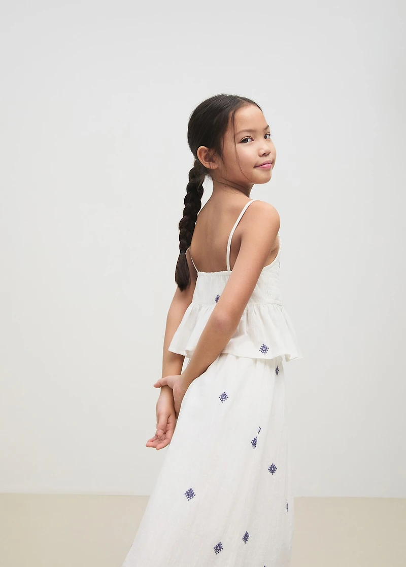 Ruffled blouse with embroidered details