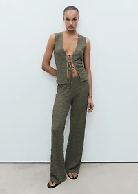 Textured top with bow