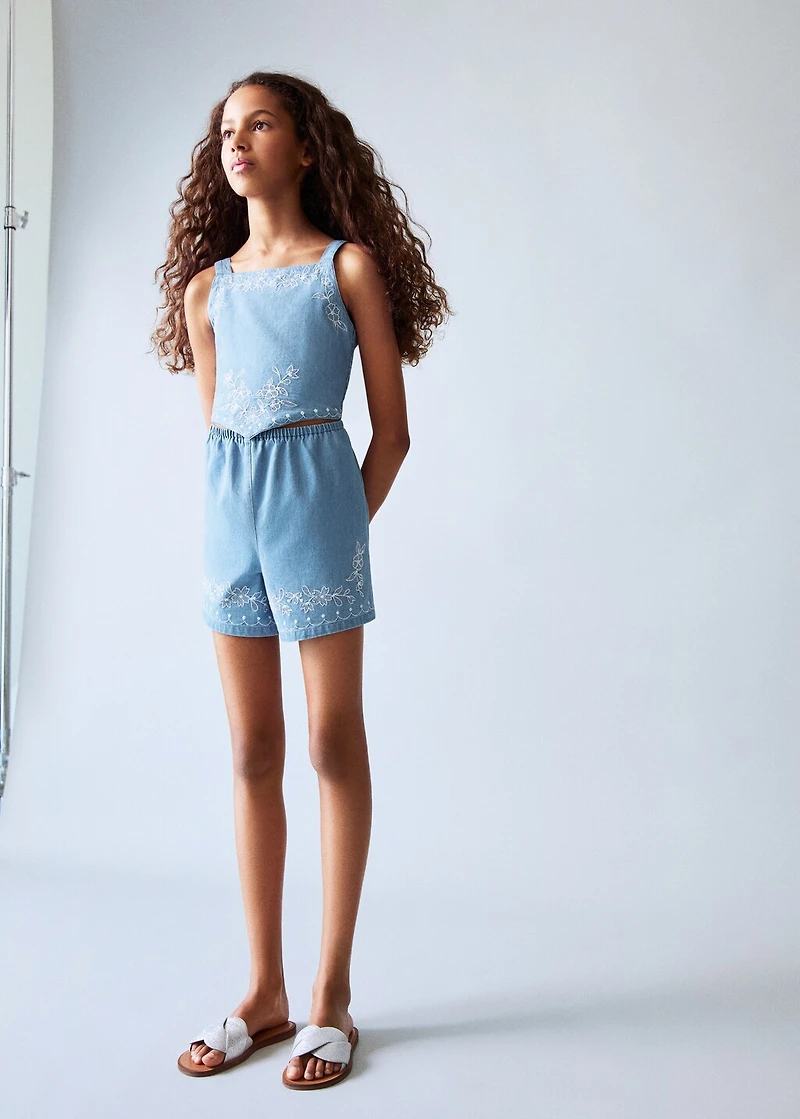 Denim jumpsuit with embroidered detail