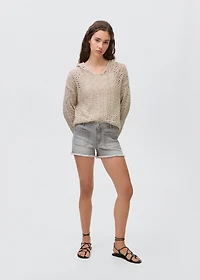 Knitted sweater with hood and lace pattern