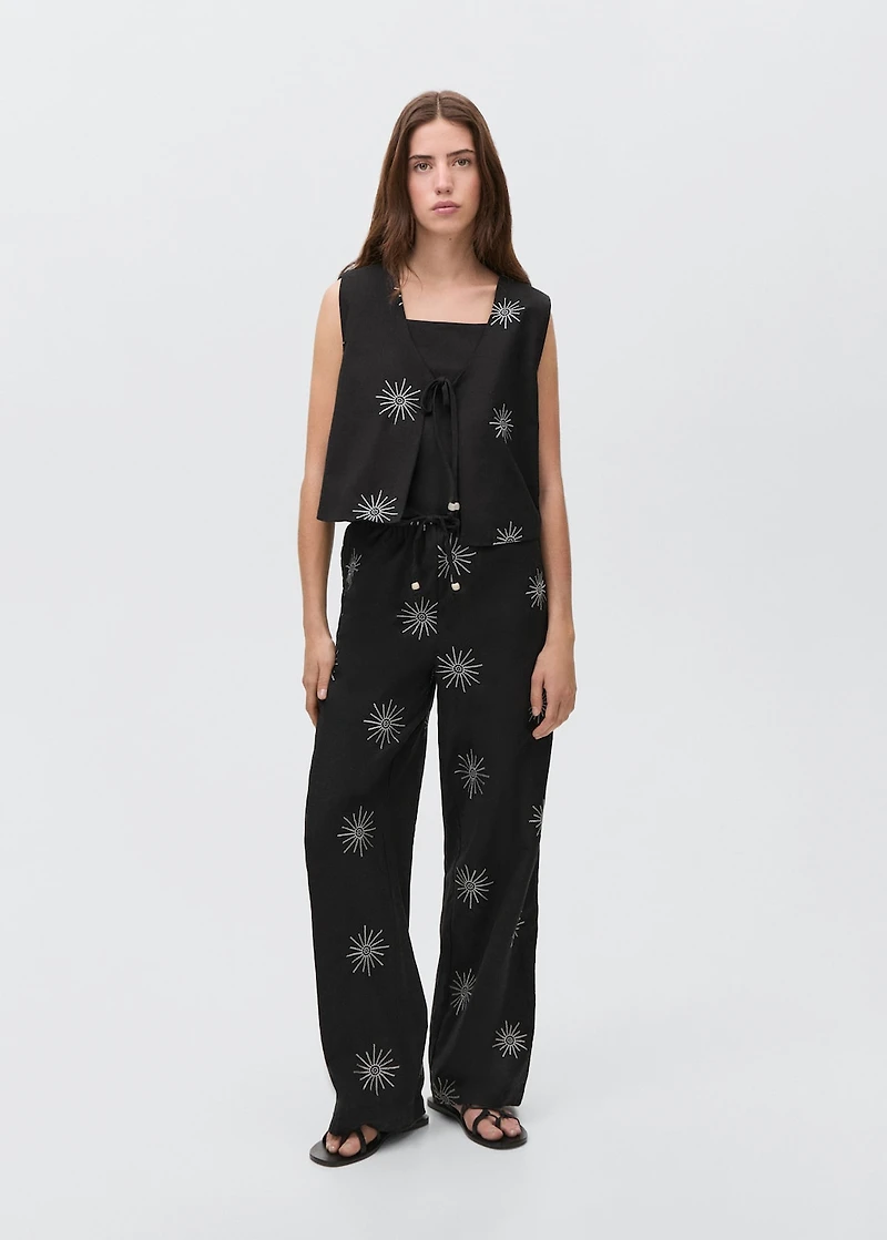 Long pants with embroidered details
