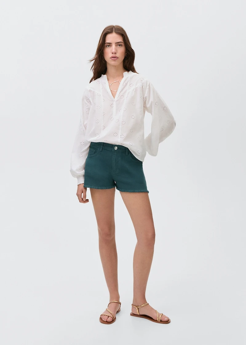 Denim shorts with frayed hem