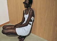 Short cut-out dress with bows