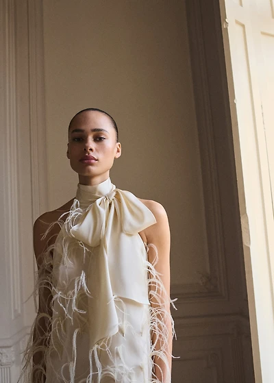 Halter dress with feather decoration