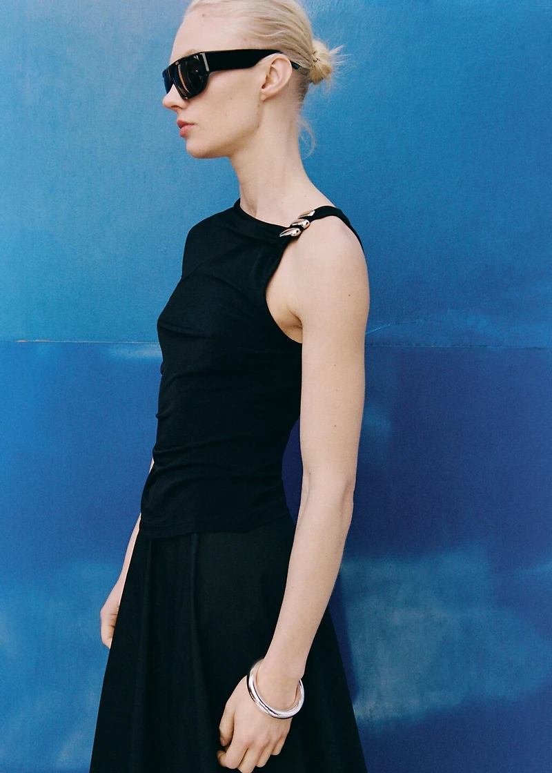 Asymmetrical top with metallic appliqué