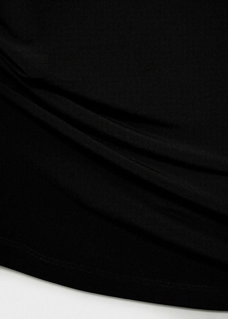 Asymmetrical top with metallic appliqué