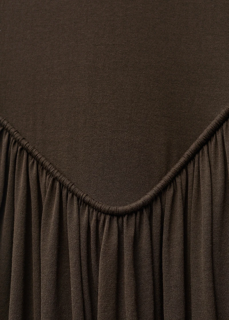 Semi-transparent dress with puffed hem