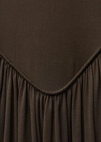 Semi-transparent dress with puffed hem