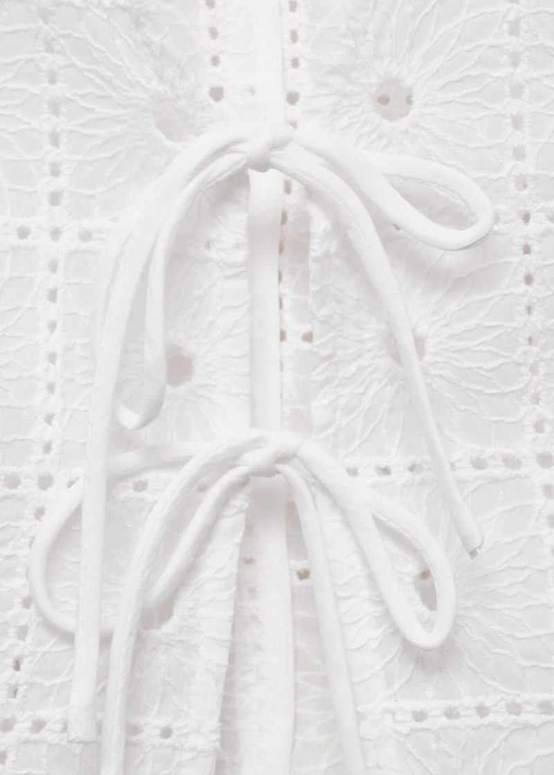 Embroidered cotton vest with bows