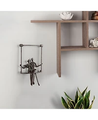 Danya B. Couple Sitting on a Window Seal Iron Wall Piece