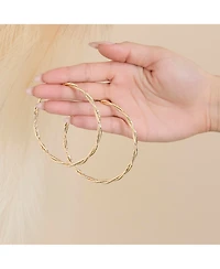 Jessica Simpson Light Gold Twist Hoop Earrings
