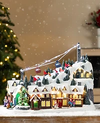 Glitzhome 16" Christmas Oversized Resin Lighted Musical Skiing Village
