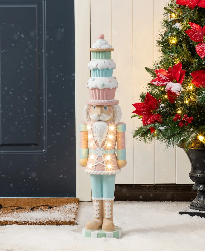 Glitzhome 28" Lighted Macaron Resin Christmas Cupcake Nutcracker Porch Decor