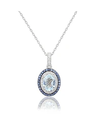 Suzy Levian Sterling Silver Oval Cut Topaz And Sapphire Double Halo Pendant
