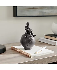 Danya B Brown Cast Iron Boy Reading on Globe Sculpture