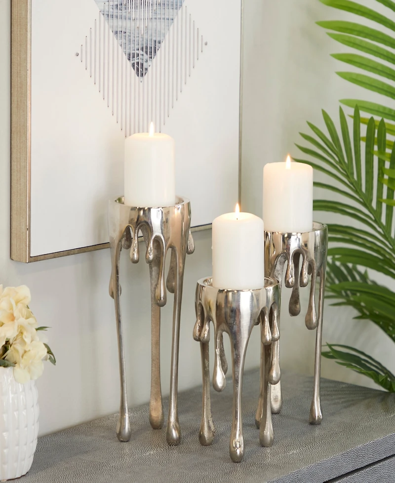 CosmoLiving Aluminum Abstract Pillar Drip Candle Holder with Melting Designed Legs Set of 3 - 12", 10", 8" H