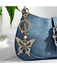 Jessica Simpson Butterfly Charm Keychain – Elegant Gold-Tone with Blue Accents