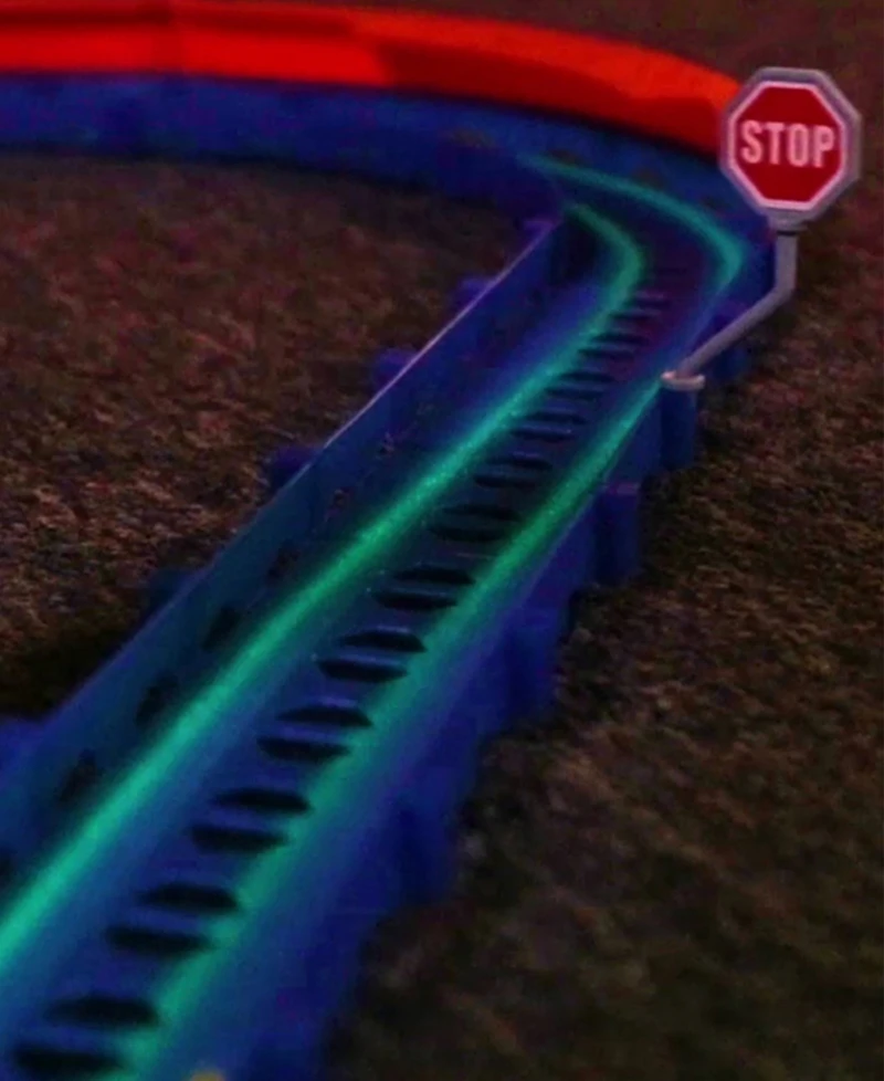 R/C car and track with three loops and glow trace technology.