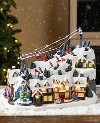 Glitzhome 16" Christmas Oversized Resin Lighted Musical Skiing Village