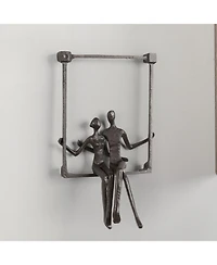 Danya B. Couple Sitting on a Window Seal Iron Wall Piece