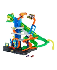 Hot Wheels 1:64 scale City Ultimate T-Rex Garage with 2 Toy Cars & Storage for 50+, Race & Stunt, Dino Nemesis