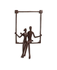Danya B. Couple Sitting on a Window Seal Iron Wall Piece