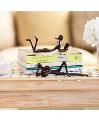 Danya B. Man and Woman Leisurely Reading Bronze Sculptures - Set of 2