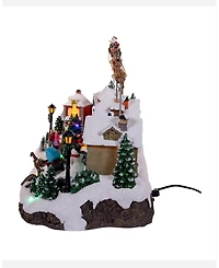 Kurt Adler 7.3-Inch Battery Operated Multicolor Led Lighted Musical Santa and Sleigh Table Piece