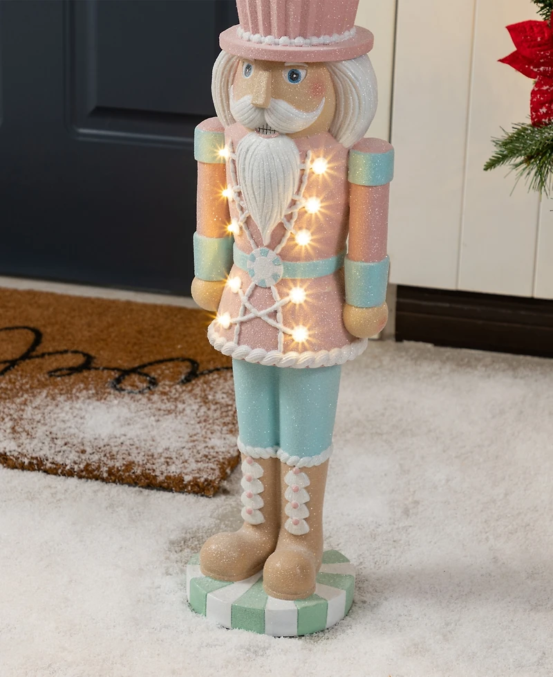 Glitzhome 28" Lighted Macaron Resin Christmas Cupcake Nutcracker Porch Decor