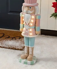 Glitzhome 28" Lighted Macaron Resin Christmas Cupcake Nutcracker Porch Decor