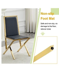 Streamdale Furniture 4-pack gold metal framed black Pu dining chairs with ergonomic design.