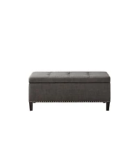 Modern tufted storage bench with soft-close lid, grey linen upholstery, button tufting, black wood legs, and interior for bedroom or entryway.