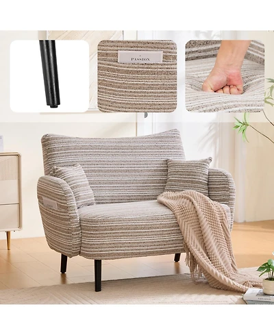 Streamdale Furniture Modern two-seater sofa with armrests, pillows, and storage pockets.