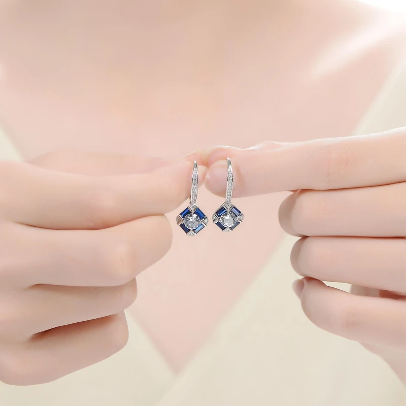 Genevive Sterling Silver White Gold Plated and Blue Cubic Zirconia Leverback Earrings