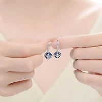 Genevive Sterling Silver White Gold Plated and Blue Cubic Zirconia Leverback Earrings