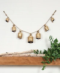 Rosemary Lane Metal Tibetan Inspired String Hanging Decorative Cow Bell with Jute Hanging Rope, 53" x 5" x 7"